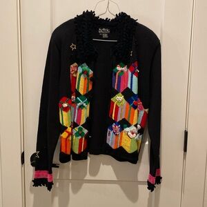 Berek Christmas Sweater.  Fringe around neck.  Presents on front‎ of sweater.